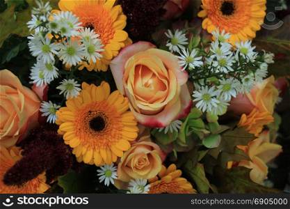 Yellow and white wedding flowers: yellow gerber and roses and white aster