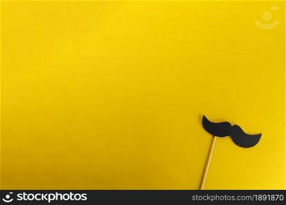 yellow background with decorative fake mustache. Resolution and high quality beautiful photo. yellow background with decorative fake mustache. High quality and resolution beautiful photo concept