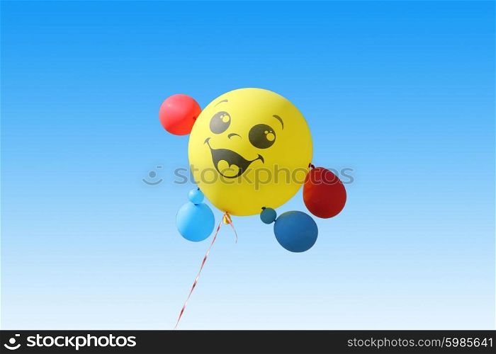 Yellow balloon flying on a blue sky background. Yellow balloon flying on a blue sky background.
