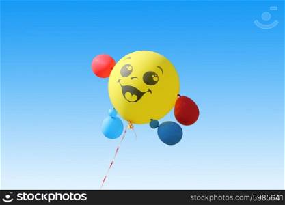 Yellow balloon flying on a blue sky background. Yellow balloon flying on a blue sky background.