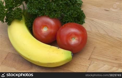 yellow banana red tomato and green parsley