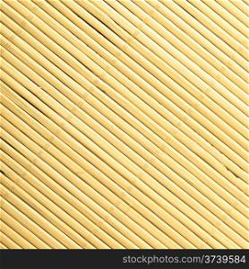 Yellow beige bamboo mat surface pattern diagonal background texture. Square format