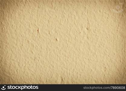 Yellow beige paint concrete grunge wall background or texture