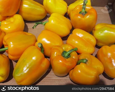 Yellow bell peppers, paprika in market place