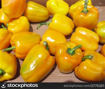 Yellow bell peppers, paprika in market place