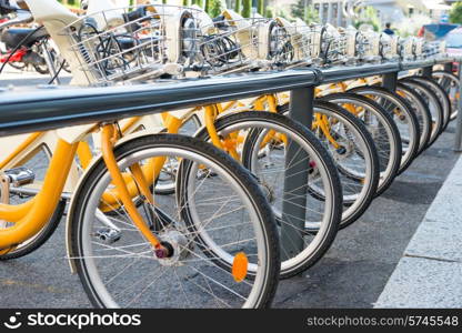 Yellow bikes parking on the street in Europe