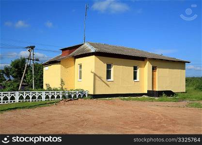yellow building on railway