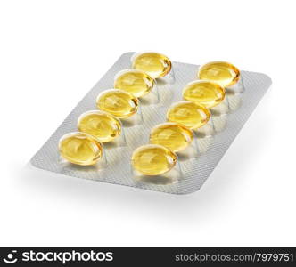 yellow capsules in blister close-up isolated on a white background
