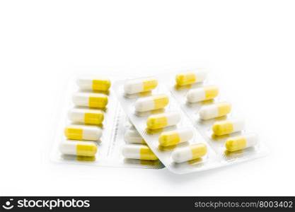 Yellow capsules pill blister pack. Yellow capsules pill blister pack on white background