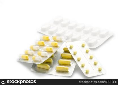 Yellow capsules pill blister pack. Yellow capsules pill blister pack on white background