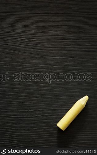 yellow chalk on wooden texture