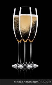 Yellow champagne glasses with bubbles isolated on black background