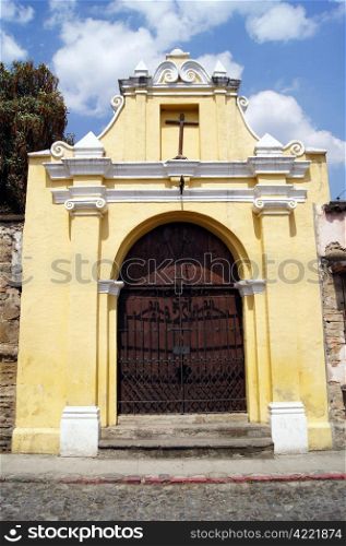 Yellow chapel on the street in Antigua Guatemala