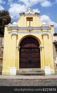 Yellow chapel on the street in Antigua Guatemala