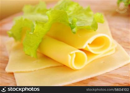 yellow cheese on green leaf