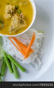 yellow chicken curry. Thai rice vermicelli served with yellow curry