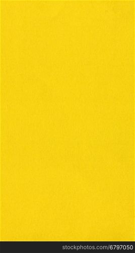 Yellow color paper - vertical. Yellow colour paper useful as a background - vertical
