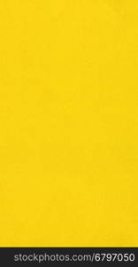Yellow color paper - vertical. Yellow colour paper useful as a background - vertical