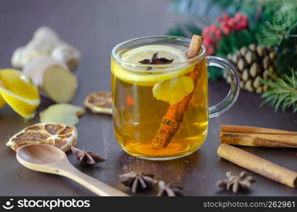 Yellow colored lemon ginger tea with all its ingredients in dark Gothic colors.
