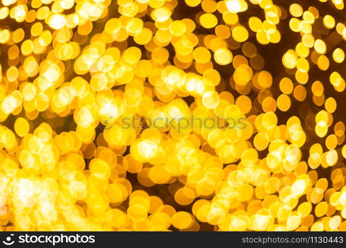 Yellow Colorful light Abstract circular bokeh of Christmas tree background Decoration During Christmas and New Year.