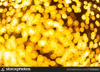 Yellow Colorful light Abstract circular bokeh of Christmas tree background Decoration During Christmas and New Year.