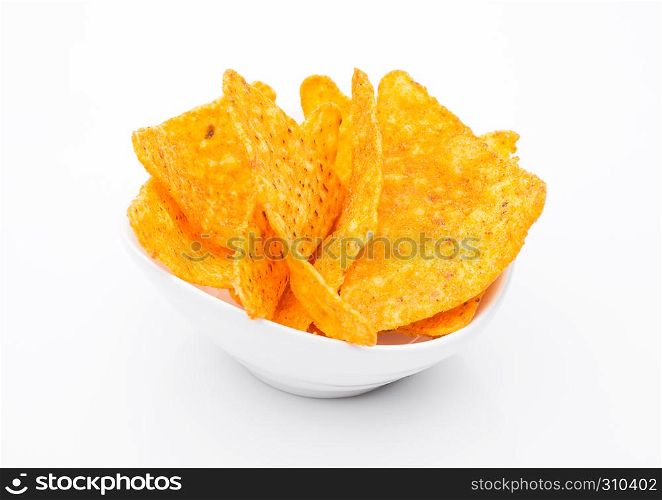 Yellow corn mexican nachos in white bowl on white background