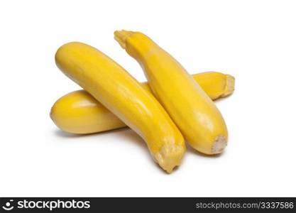 Yellow courgettes on white background