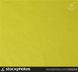 yellow crumpled stretching soft fabric, full frame