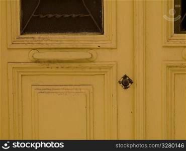 Yellow door in Mykonos Greece