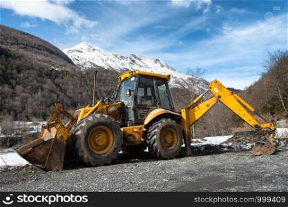 yellow earth mover in the mountain