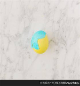 yellow easter egg with blue shell