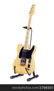 yellow electric guitar on stand, isolated on white background