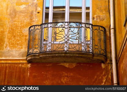 yellow europe italy lombardy in the milano old window closed brick abstract grate