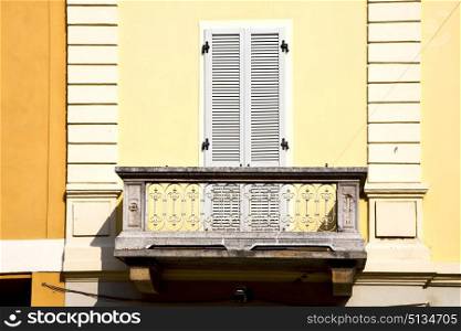 yellow europe italy lombardy in the milano old window closed brick abstract grate