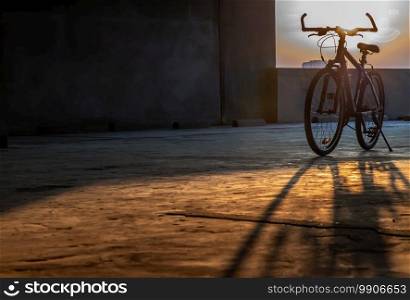 Yellow evening sun rays pass through Mountain bike in the parking lot. Selective focus.