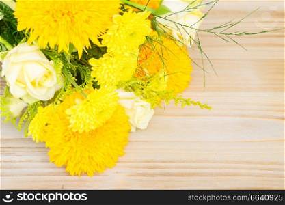 Yellow fall bouquet on wooden table with copy spacebackground. Yellow fall bouquet