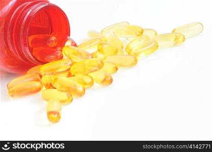 yellow fish oil capsule pile