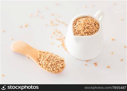 Yellow flax seed on clean kitchen table, stock photo