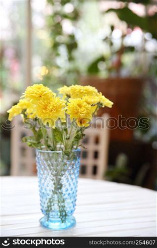 yellow flower in jar