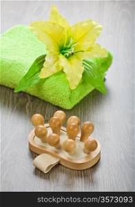 yellow flower on towel with massager