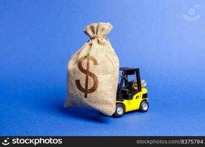 Yellow forklift truck carries a big bag of money. Attracting investment in the development and modernization of production and business projects. Revenue, profit, sales. super profit. copy space