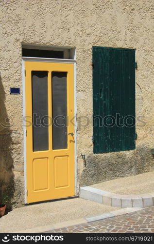 Yellow frontdoor of a house in France