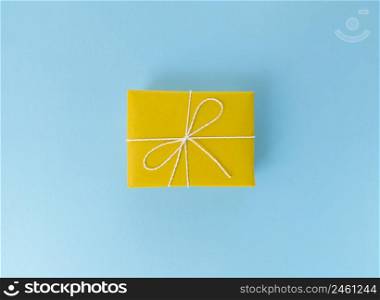 Yellow gift box on blue background.. Yellow gift box on a blue background.