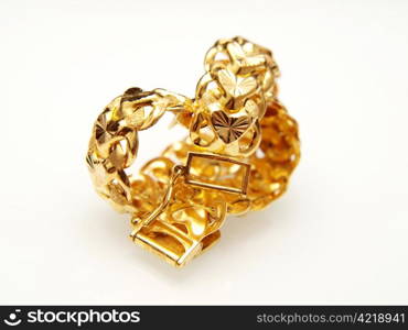 Yellow gold jewellry, isolated towards white background