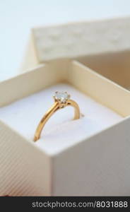 Yellow golden diamond ring in ring box