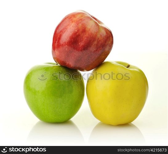 Yellow, green and red apples on white background