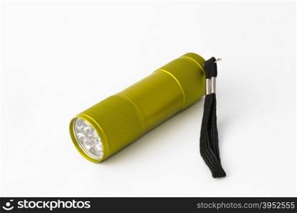 Yellow-green led aluminum flashlight on a white background