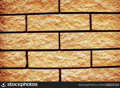 Yellow grunge texture of brick wall