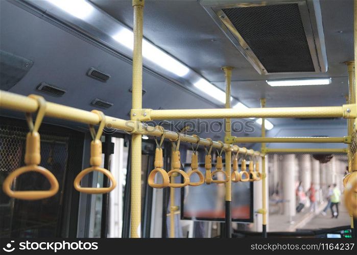 yellow handle on commuter bus. public transport
