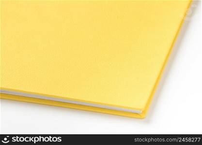 Yellow hard cover book on white background. book album on a white background